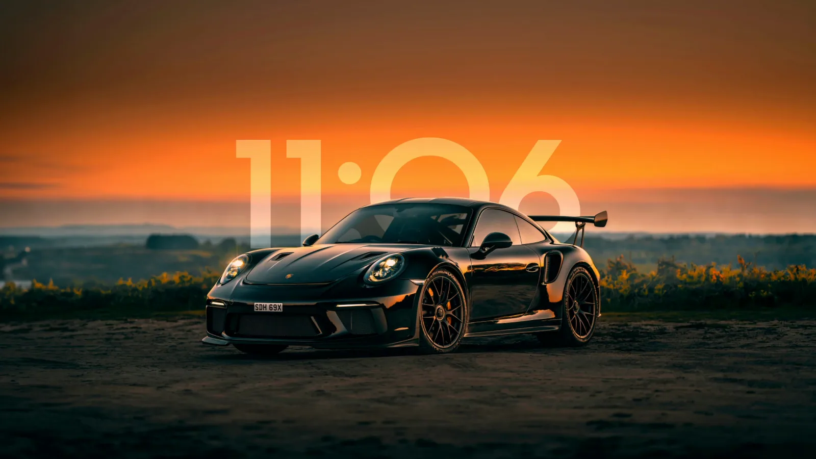 Black Porsche 911 at Sunset