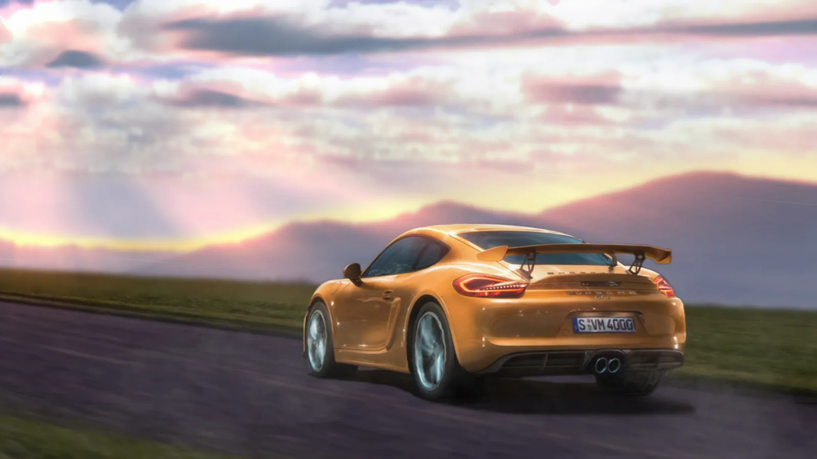 Gold Porsche Cayman GT4 on a Coastal Road