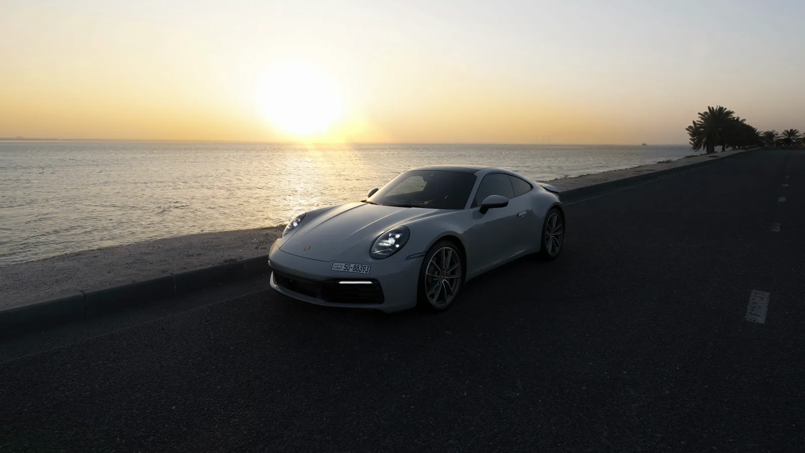 Porsche 992 by the Sea at Sunset
